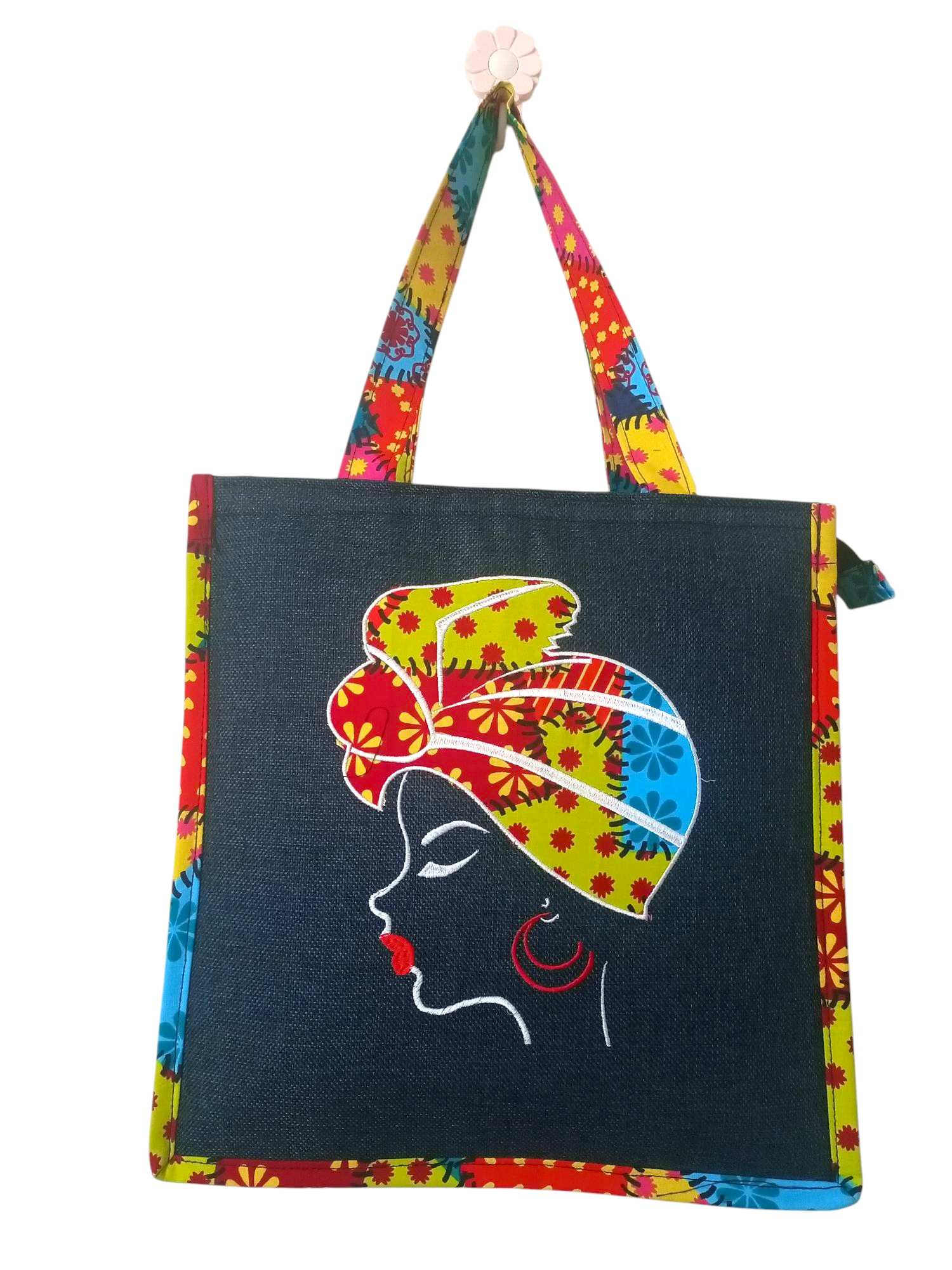 Colorful Tote Bag Featuring a Striking Embroidered Portrait of a Woman in Traditional African headwear.