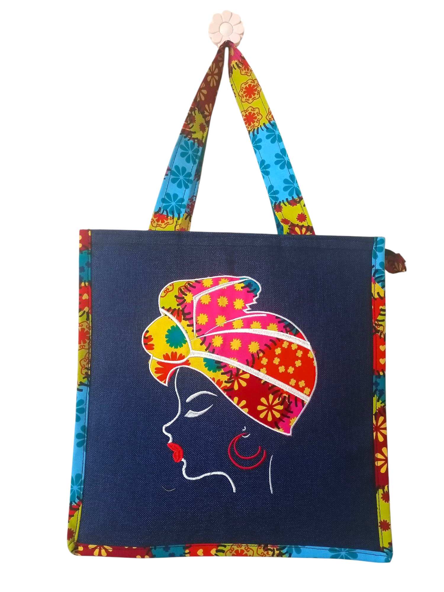Colorful Tote Bag Featuring an Embroidered Portrait of a Woman in Traditional African headwear.