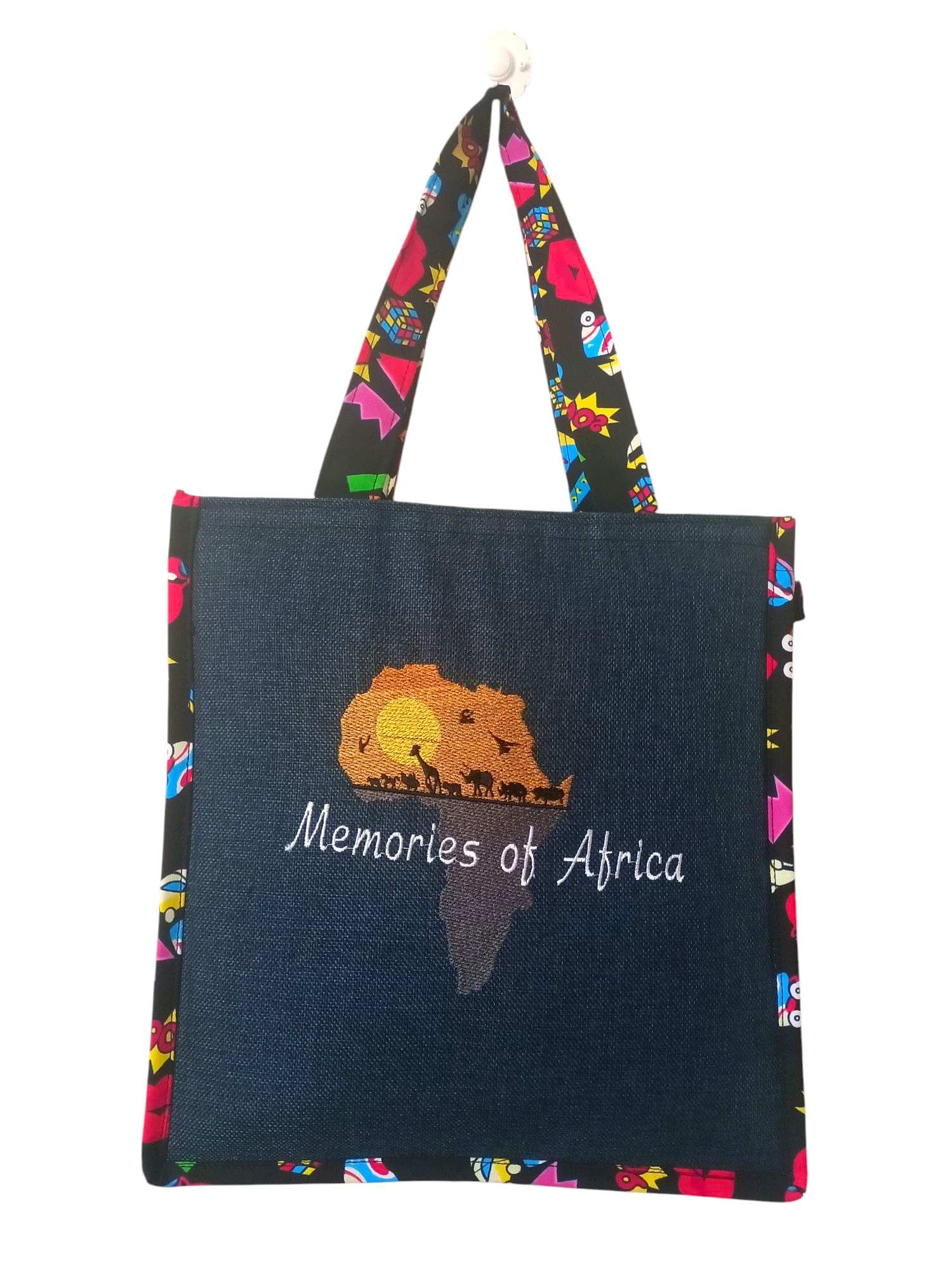 Dark Blue Tote Bag with "Memories of Africa" text, an African Landscape design, and Colorful Patterned straps.