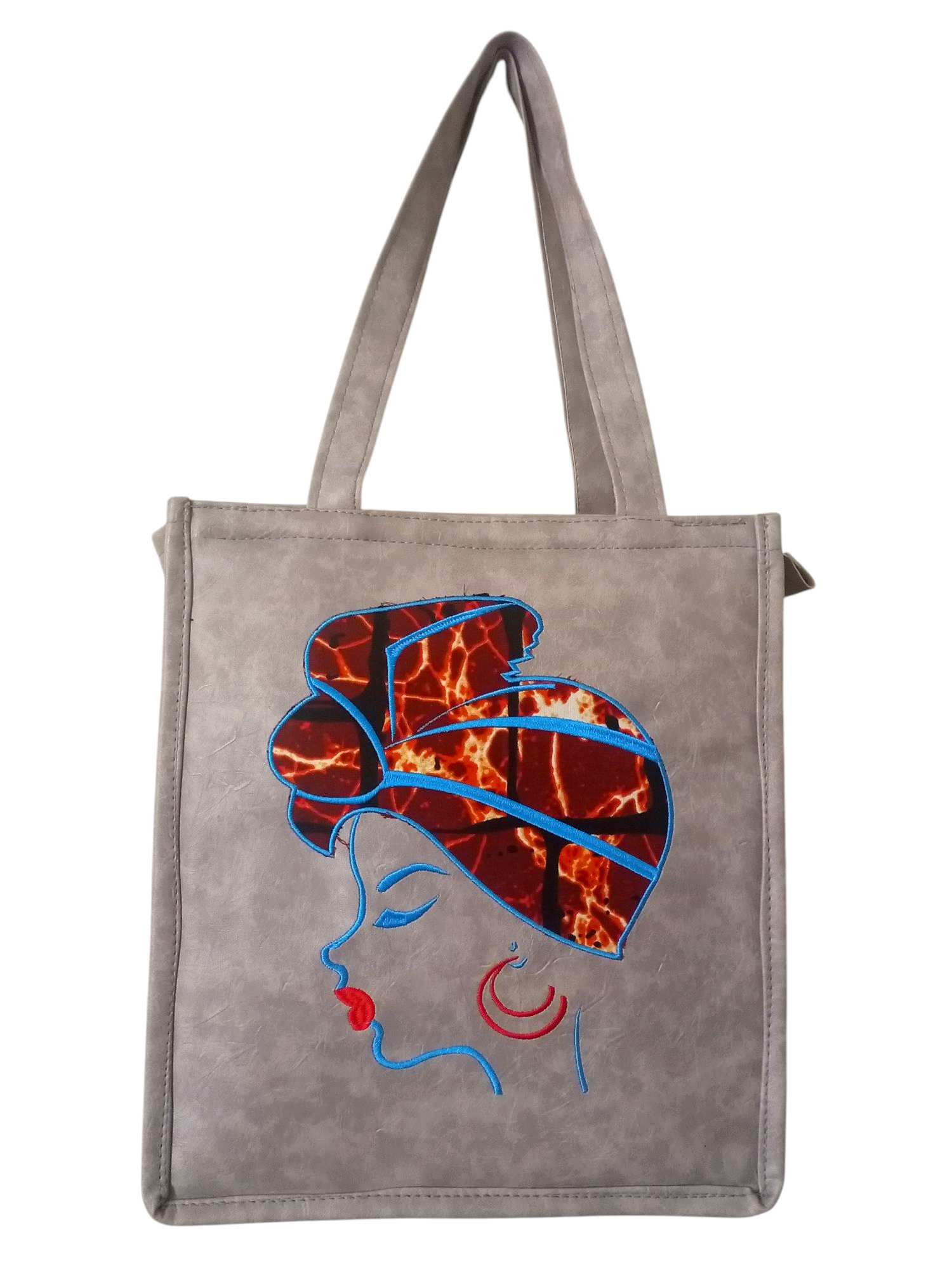 Gray Tote Bag with an Embroidered Design of a Woman Wearing a Red and Blue headwrap.