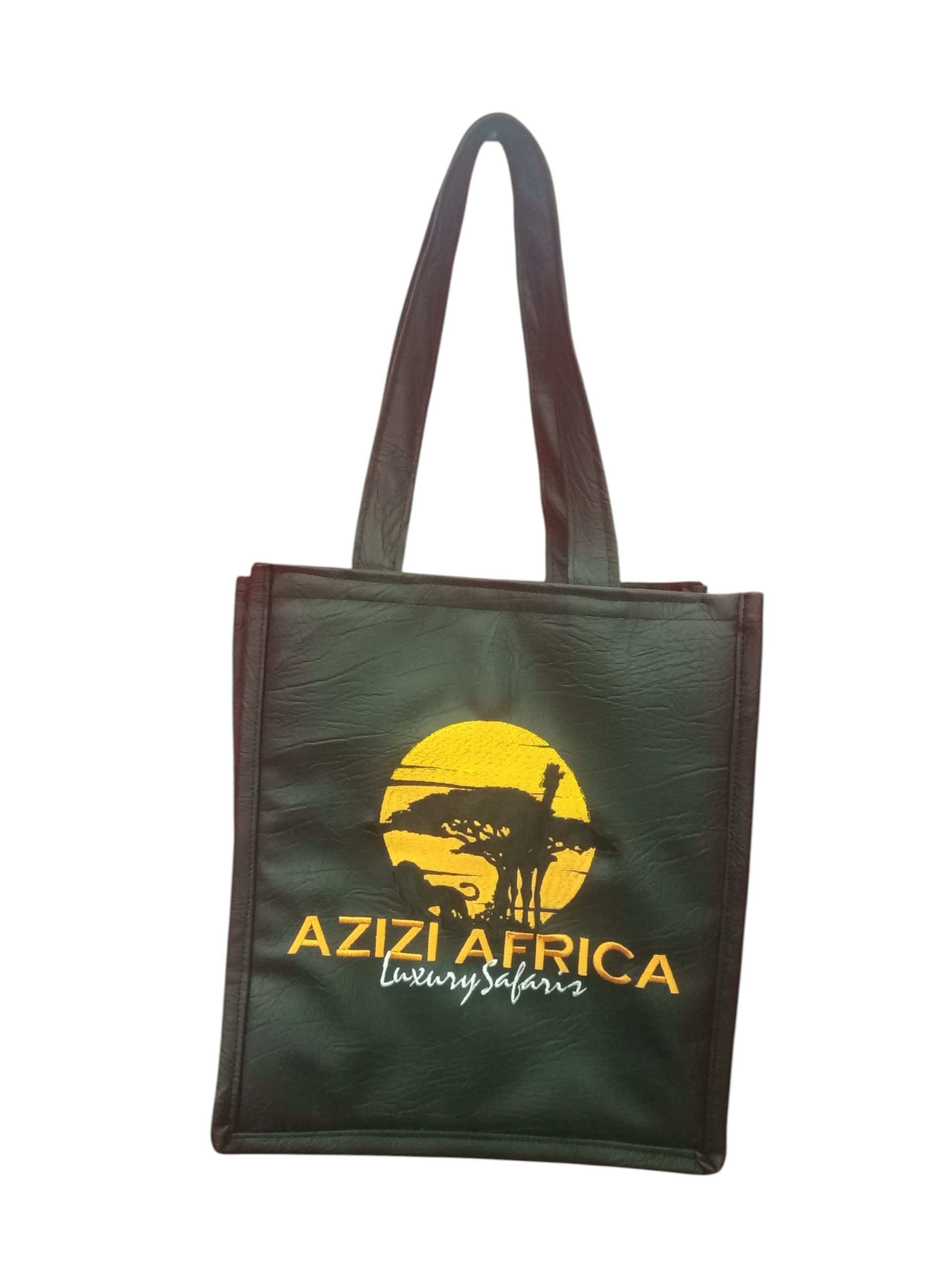 A Black Tote Bag with the "Azizi Africa Luxury Safaris" Logo Featuring an African Sunset scene.